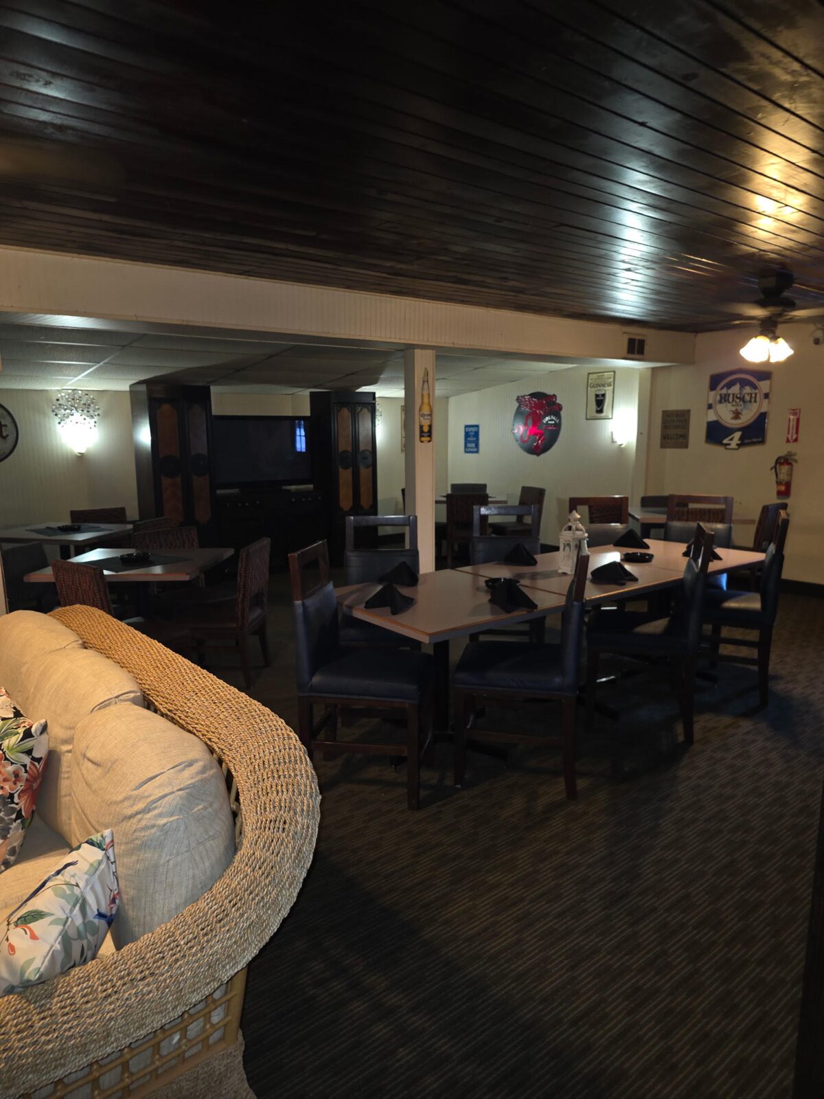 Whalen's private back room set up with tables and chairs for an event